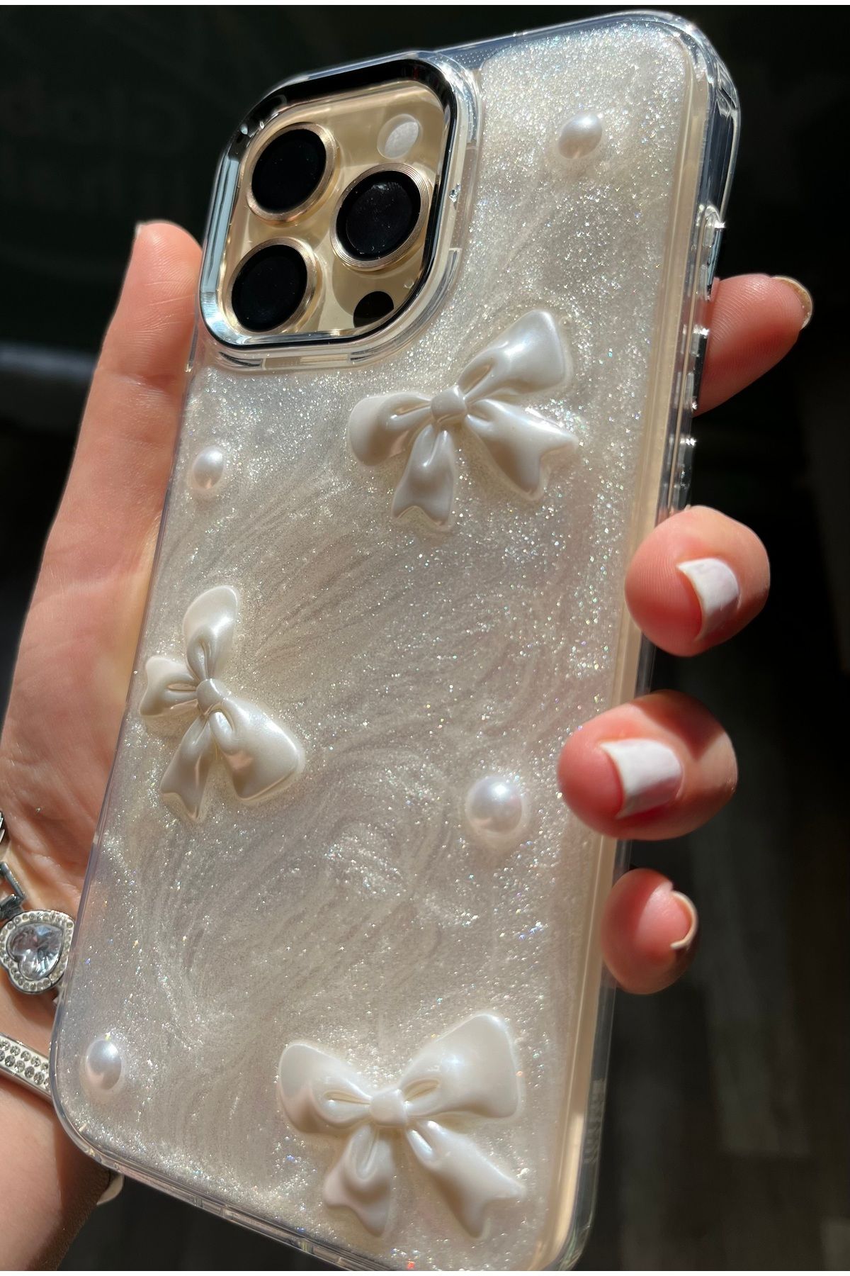 Caseji iPhone 16 Pro Max Uyumlu 3D Kurdele Detaylı Işıldayan Kılıf - Görsel 7